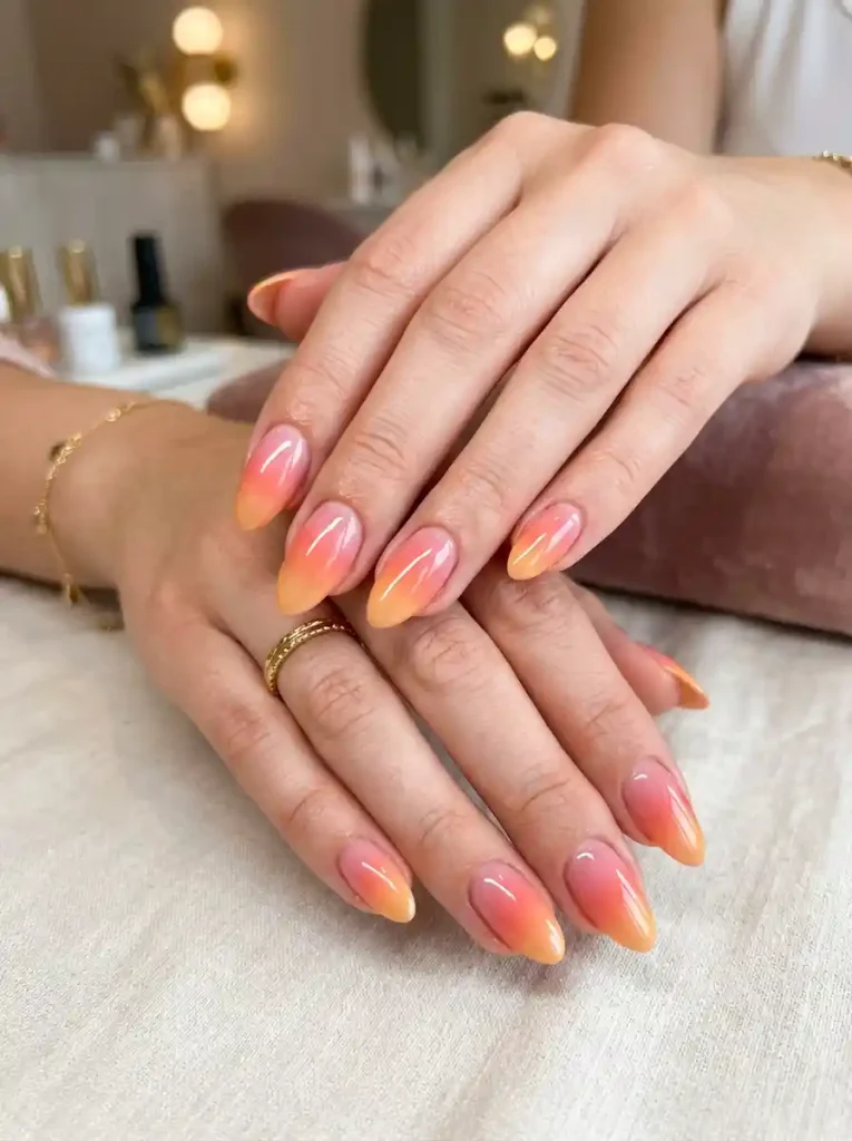 1. Sunset Aura Almond Nails